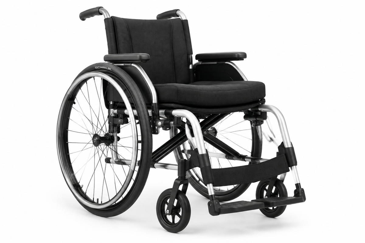 Lightweight manual wheelchair with silver and black frame on white background